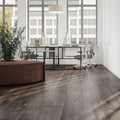 Ferry Oak 12mm laminate flooring with extra-long 2003 x 245mm wide planks, authentic oak grain detailing and natural brown tones.