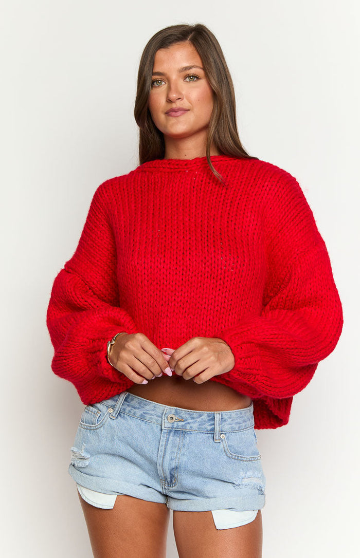 Red chunky knit cardigan with a crew neck, cropped fit, and voluminous balloon sleeves