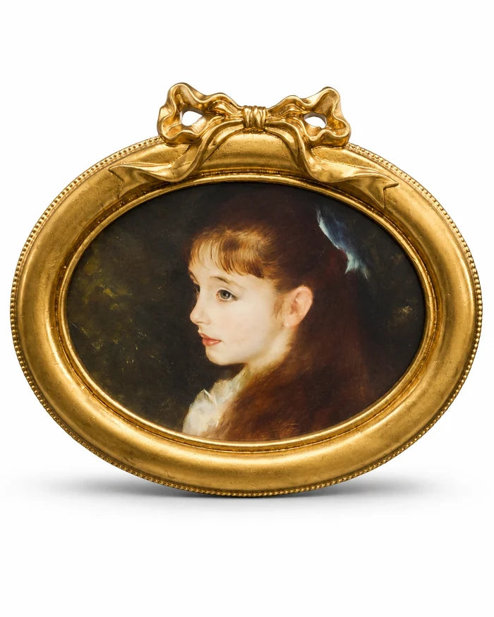 Gold oval photo frame with decorative bow detail