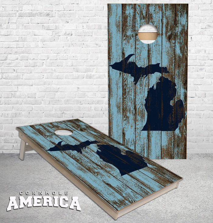 Michigan Map outline on rustic blue wood Cornhole boards