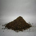 This is an image of finest Neem Cake Powder placed against white background.