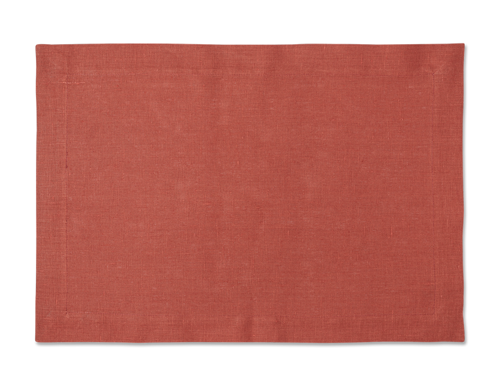 A linen placemat in the color brick