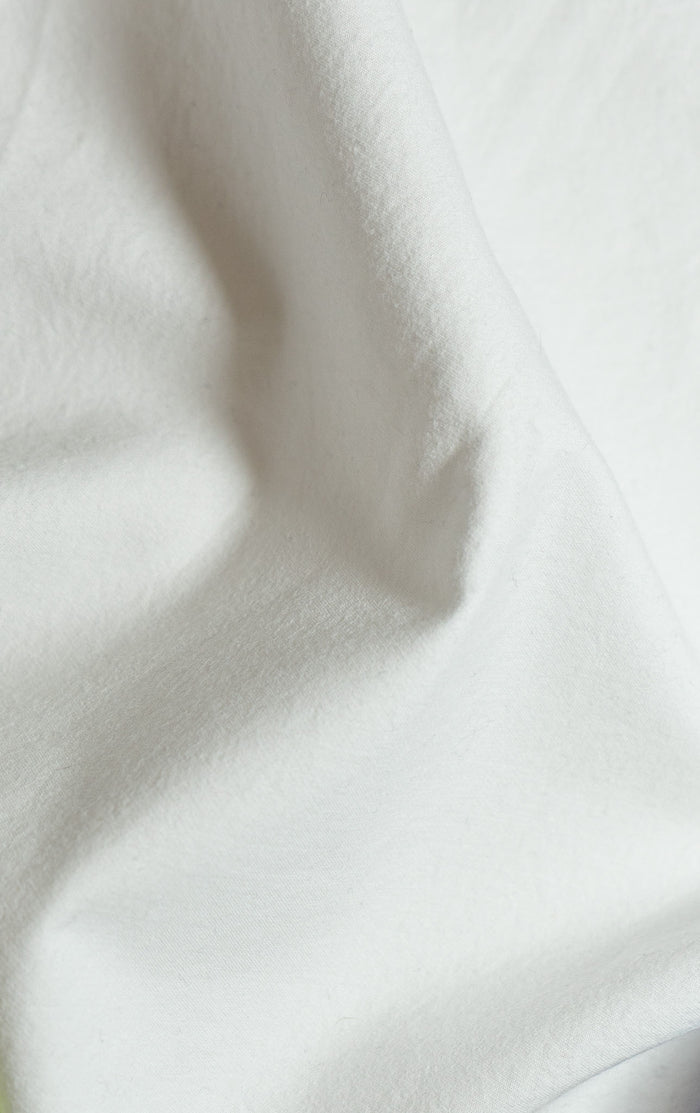 White Sei Cotton Sateen Sham - Close-Up Draped Fabric Texture, Crisp Weave Detail | MATTEO