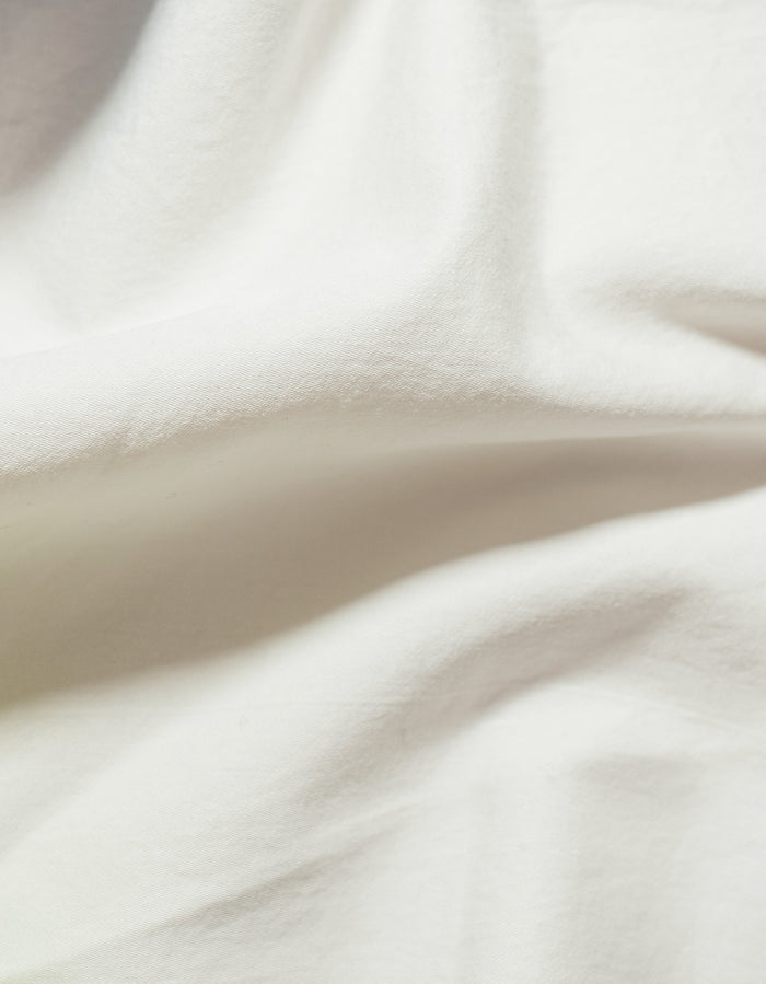 Moon Sei Cotton Sateen Sham - Close-Up Draped Fabric, Soft Warm White Sateen Sheen Detail | MATTEO