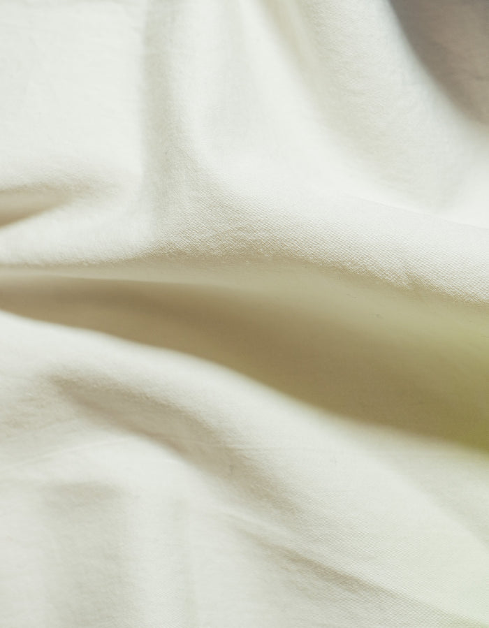 Off White Sei Cotton Sateen Sham - Close-Up Draped Fabric, Warm Ivory Sateen Weave Detail | MATTEO