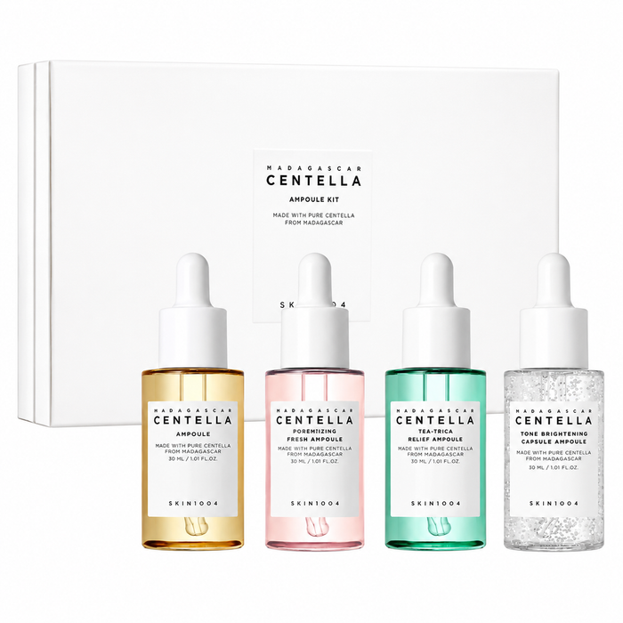skin1004 madagascar centella ampoule kit featuring four serums in a white presentation box. skincare gift set includes the original centella ampoule, poremizing fresh ampoule, tea-trica relief ampoule and tone brightening capsule ampoule to help soothe, hydrate, refine pores and brighten the complexion.