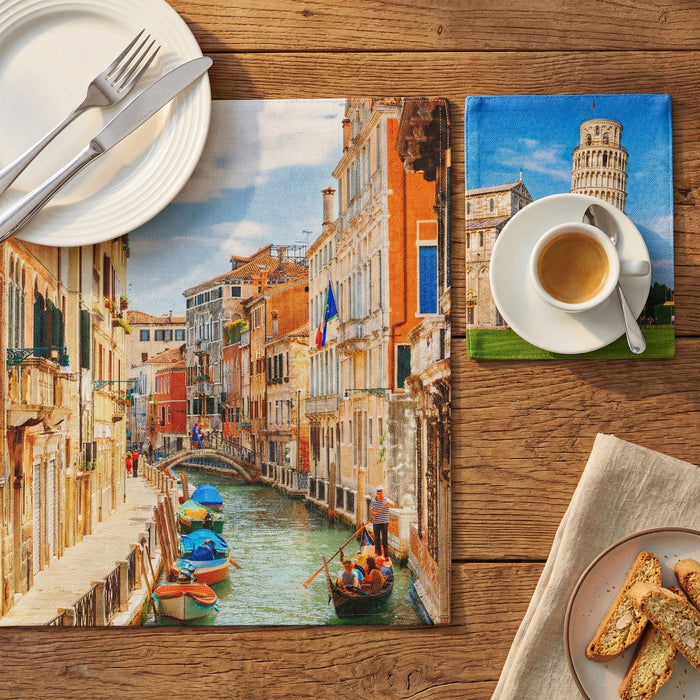 Table setting with scenic placemats of Venice and Pisa, coffee, and pastries.