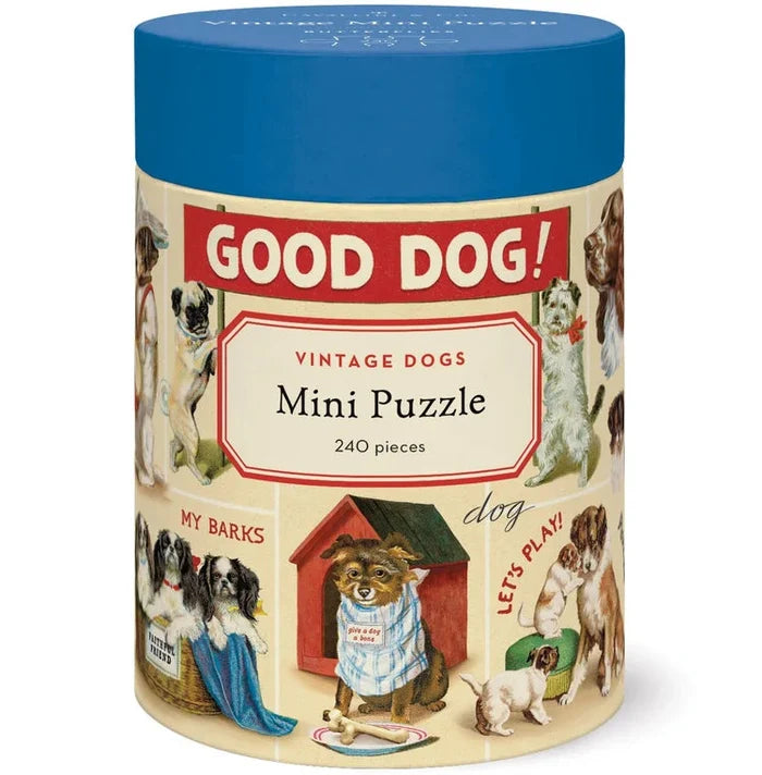 The Vintage 240 Piece Puzzle comes in a cylindrical box with a blue lid, featuring playful dog illustrations and fun sayings—perfect for puzzle lovers or as a charming gift.