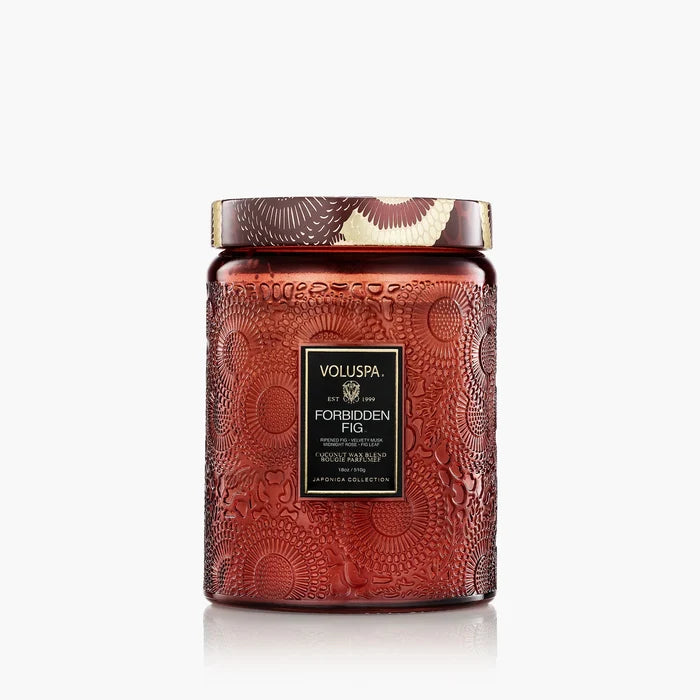 A large, embossed red Voluspa 18oz Glass Jar Candle with a gold lid features a black and gold label on the front. This clean-burning candle is showcased against a plain white background.